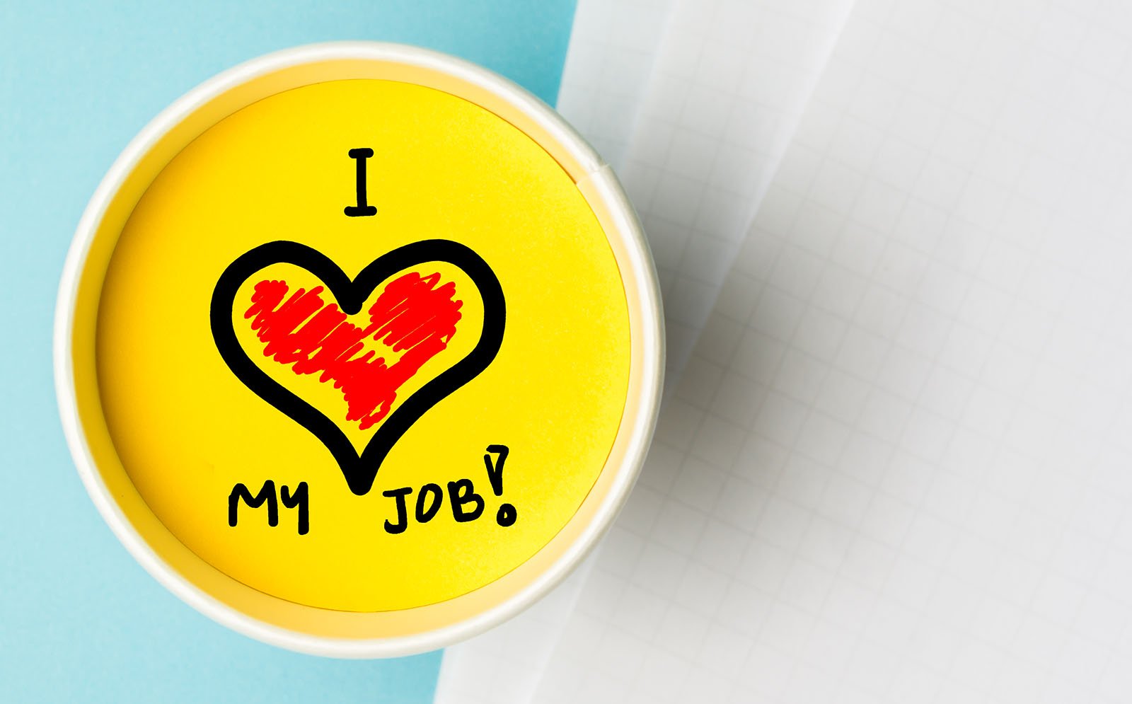 container with yellow paint that says I (heart) my job! - Level up your life: how gamification can help you achieve your goals